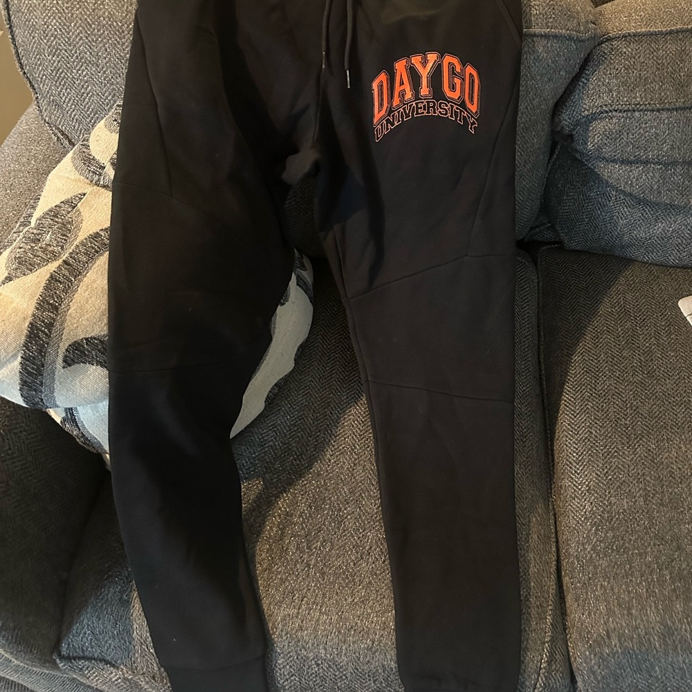 Reserved Black Sweatpants with Orange Print